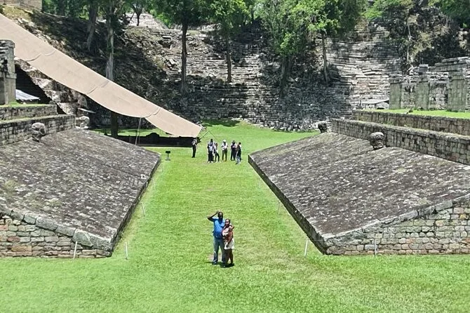 The Maya ball court at Copán with its sloped stone sides, a stop on San Pedro Sula Mayan ruins tours