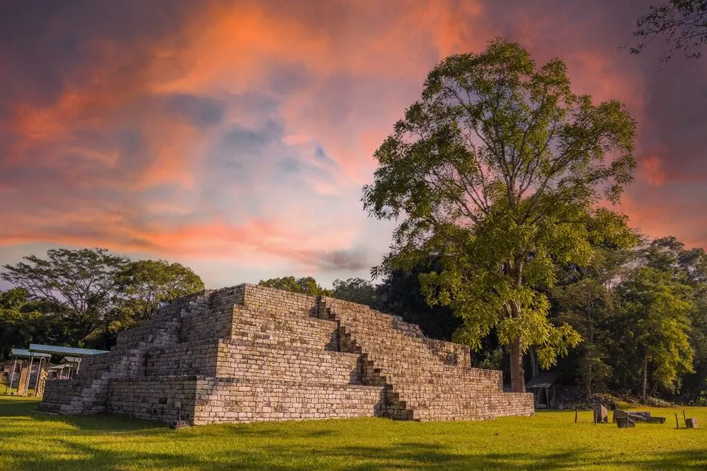 Stepped Maya pyramid at Copán under an evening sky, the site of San Pedro Sula Mayan ruins tours